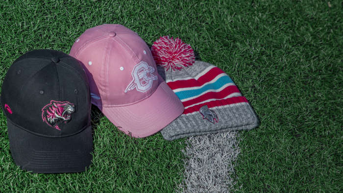 Ladies hats sitting grass field