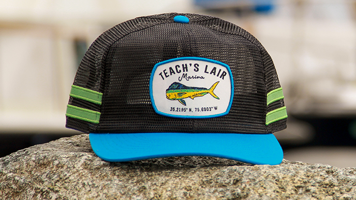 Outdoors hat sitting dockside