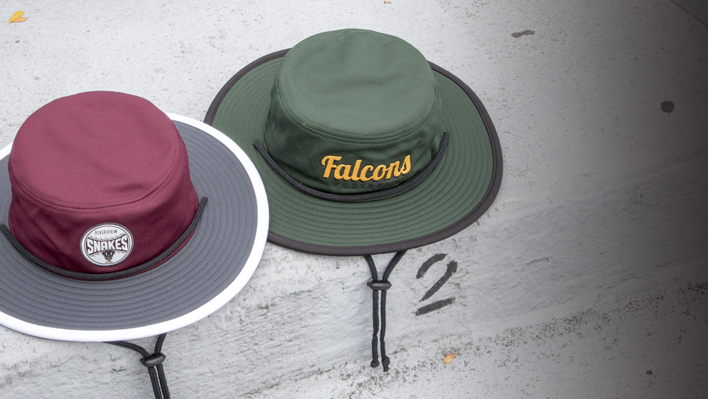 Bucket hats sitting on stone wall