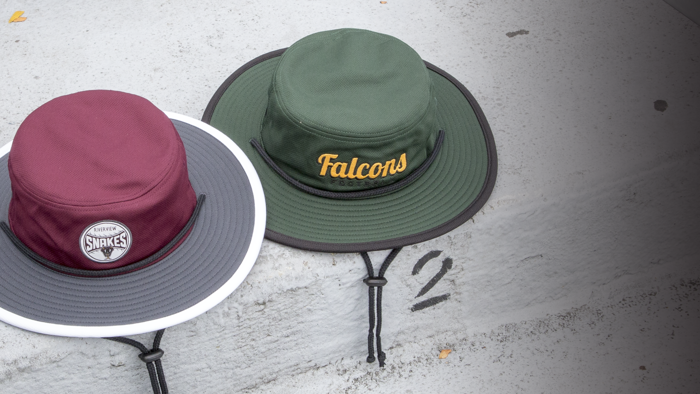 Bucket hats sitting on stone wall