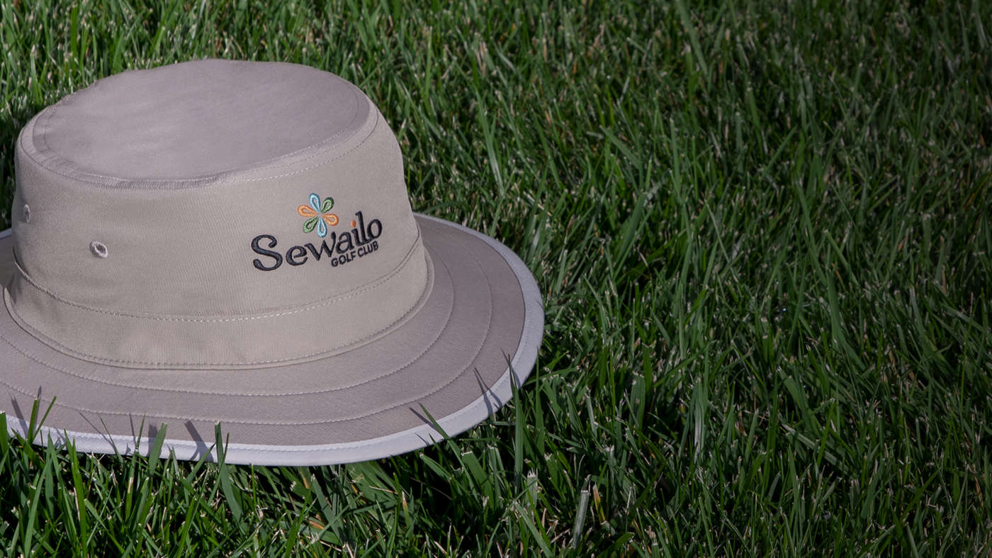 Shademaker III bucket hat sitting on porch rail