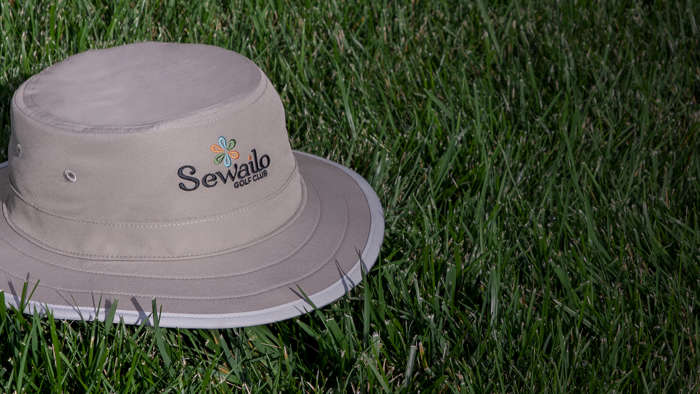 Shademaker III bucket hat sitting on porch rail