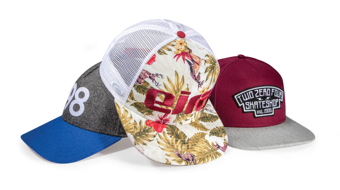 Collection of Pukka 5 panel hats in a pile.