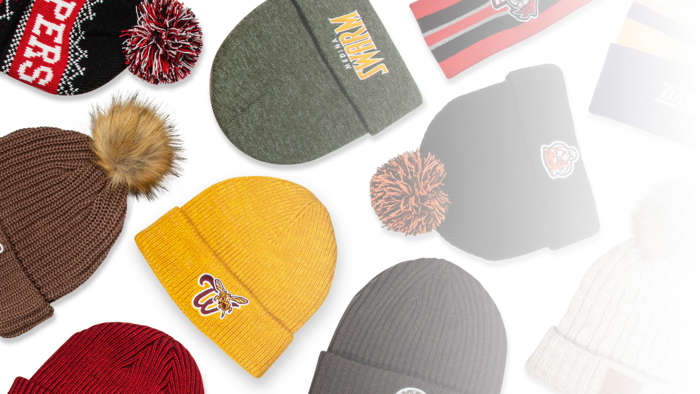 Cold Weather knit hats laying on bleacher seat