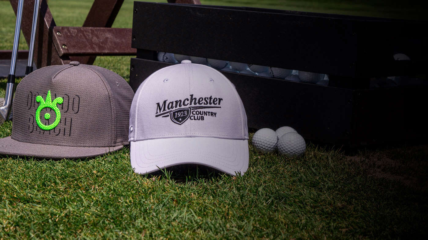 Golf Ultra-Fit hat resting in a bush