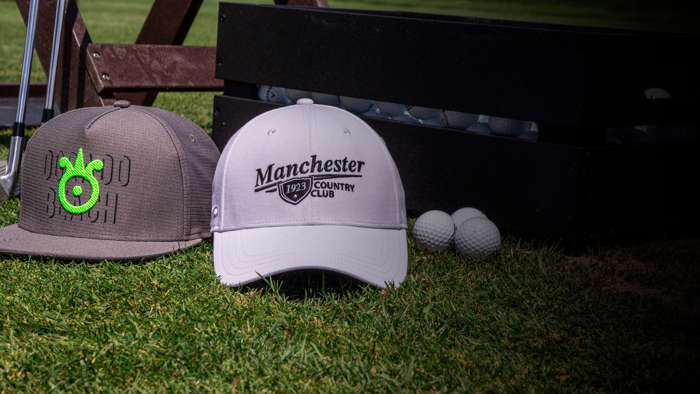 Golf Ultra-Fit hat resting in a bush