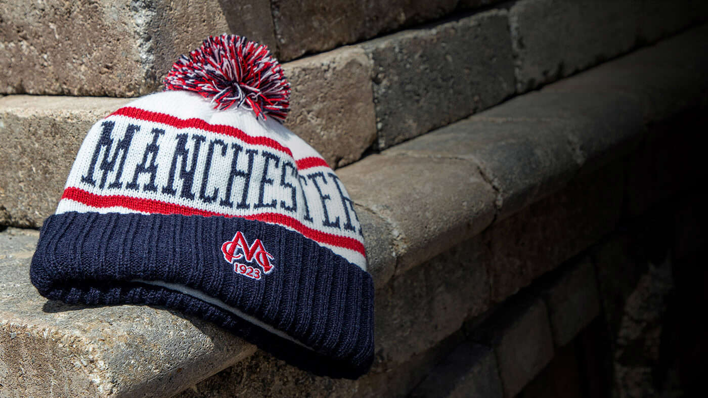 Pukka cold weather knits resting on a brick walkway