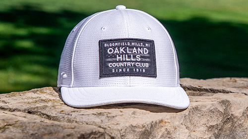 Sublimated Patriotic Golf Hat on a rock