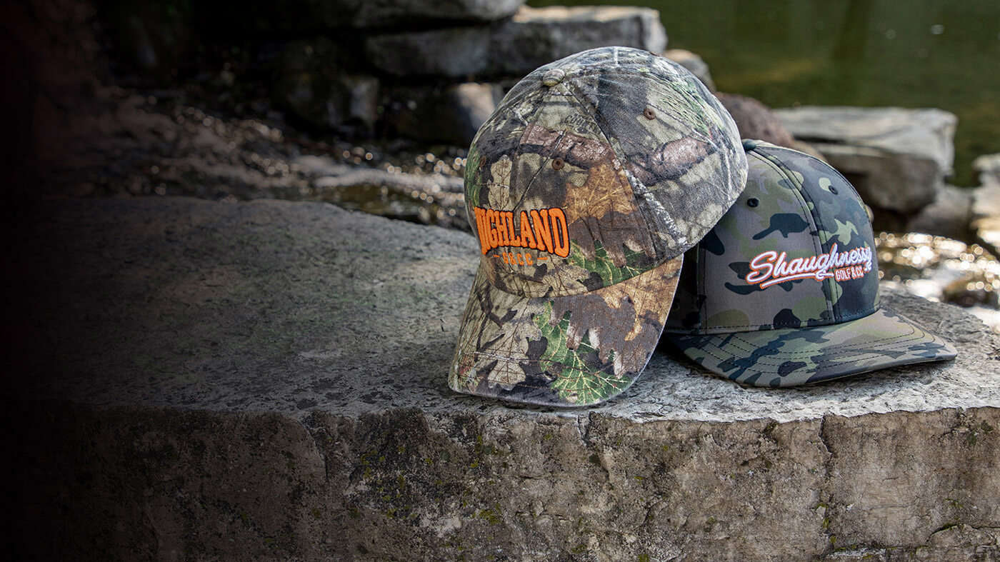 Camo boonie & hats sitting by a stream