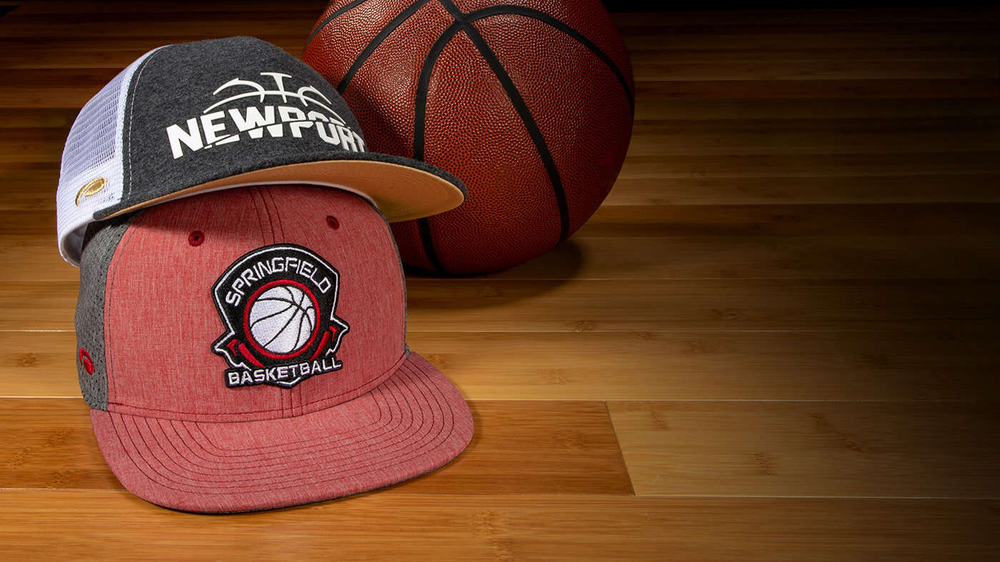 Team Basketball Hats on a court