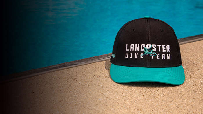 Team Swim & Dive Hat by a pool