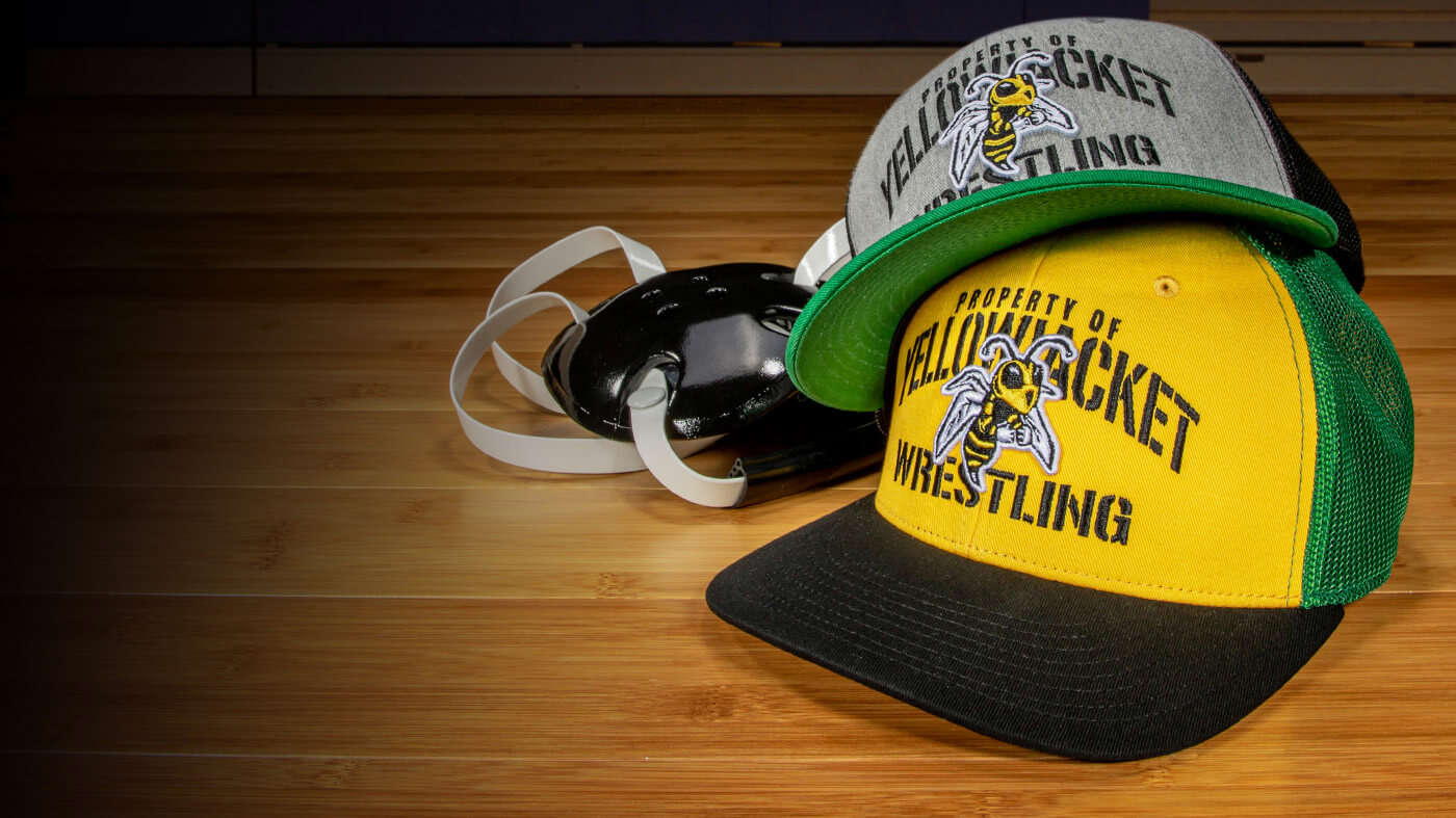 Pair of Team Sports Wrestling Hats and headgear