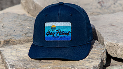 A group of Popular Look hats on a golf course