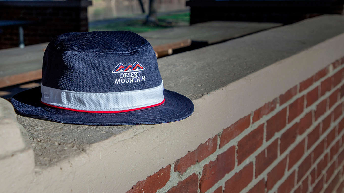 Small Brim Bucket sitting on brick wall