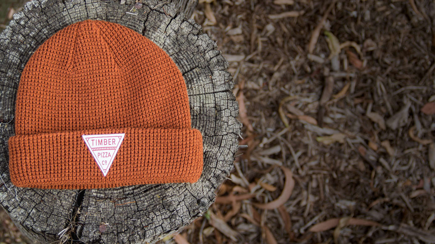 Beanie on wood stump