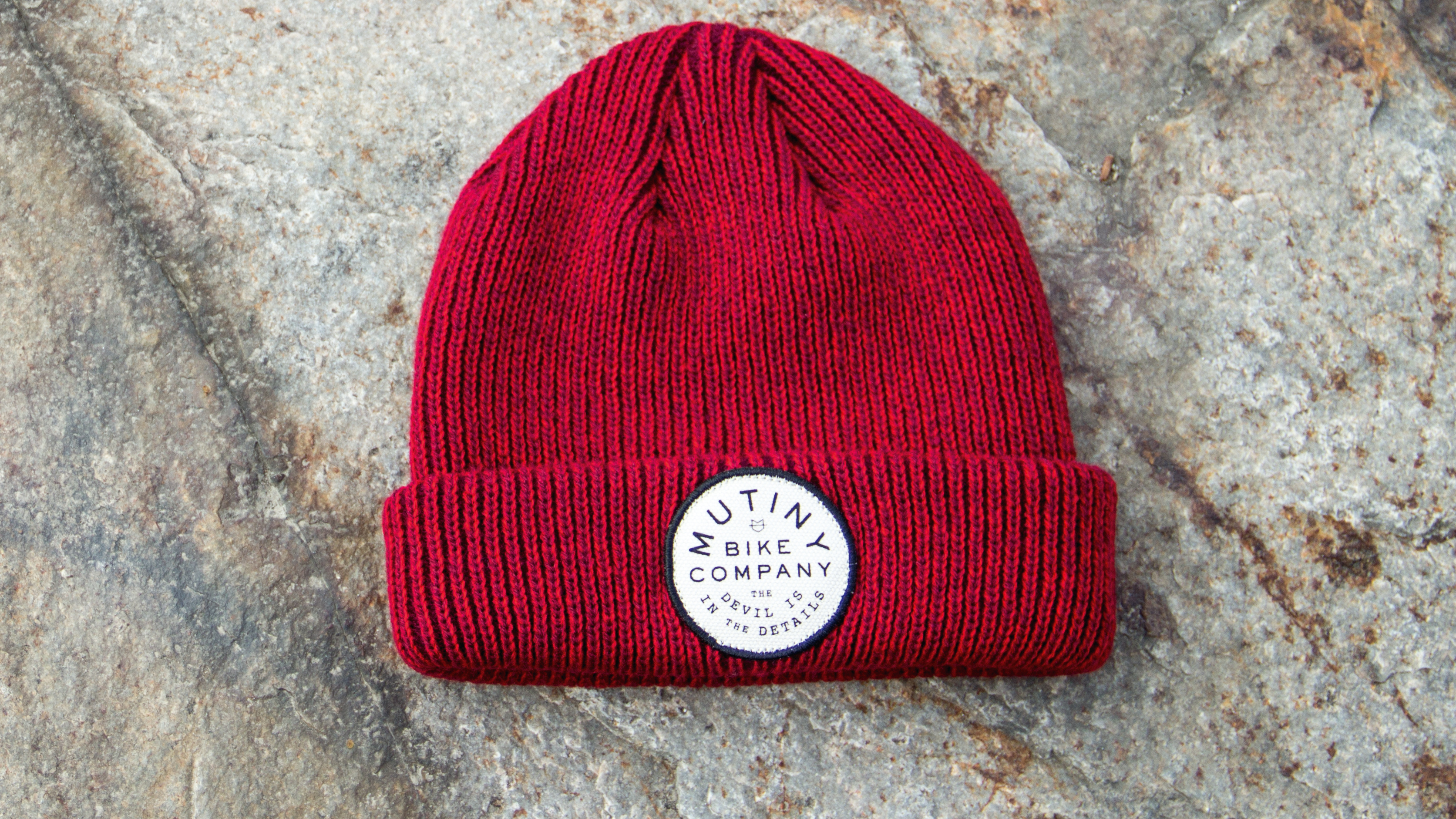 Dock-Wear Knit laying on stone