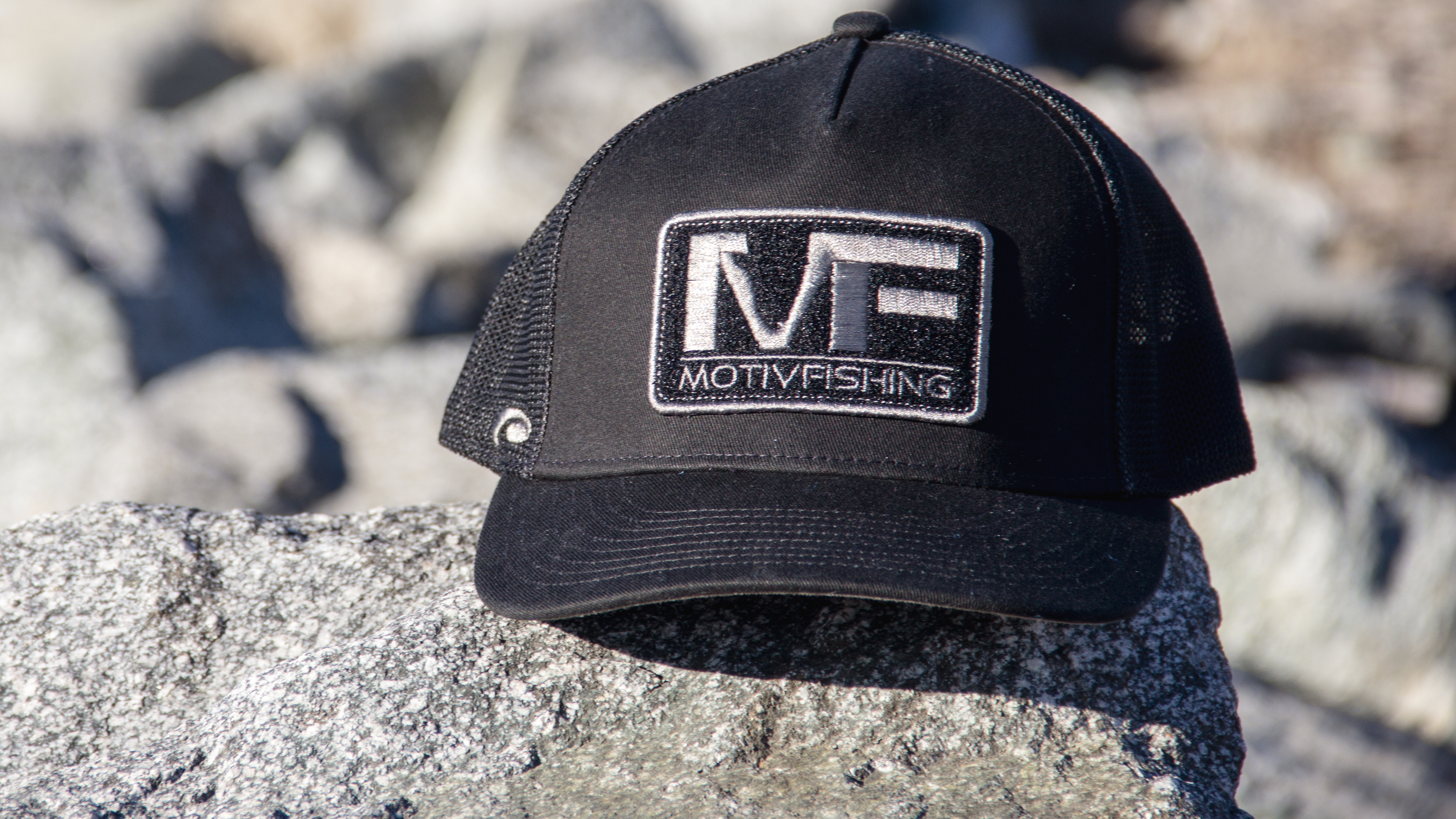 Pukka Ultra-Fit Hat sitting on a large rock