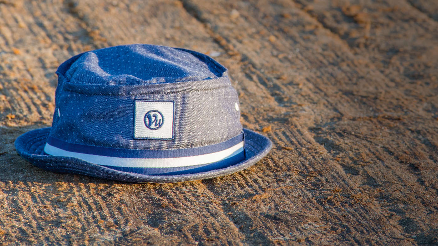 Reilley bucket hat sitting on sand