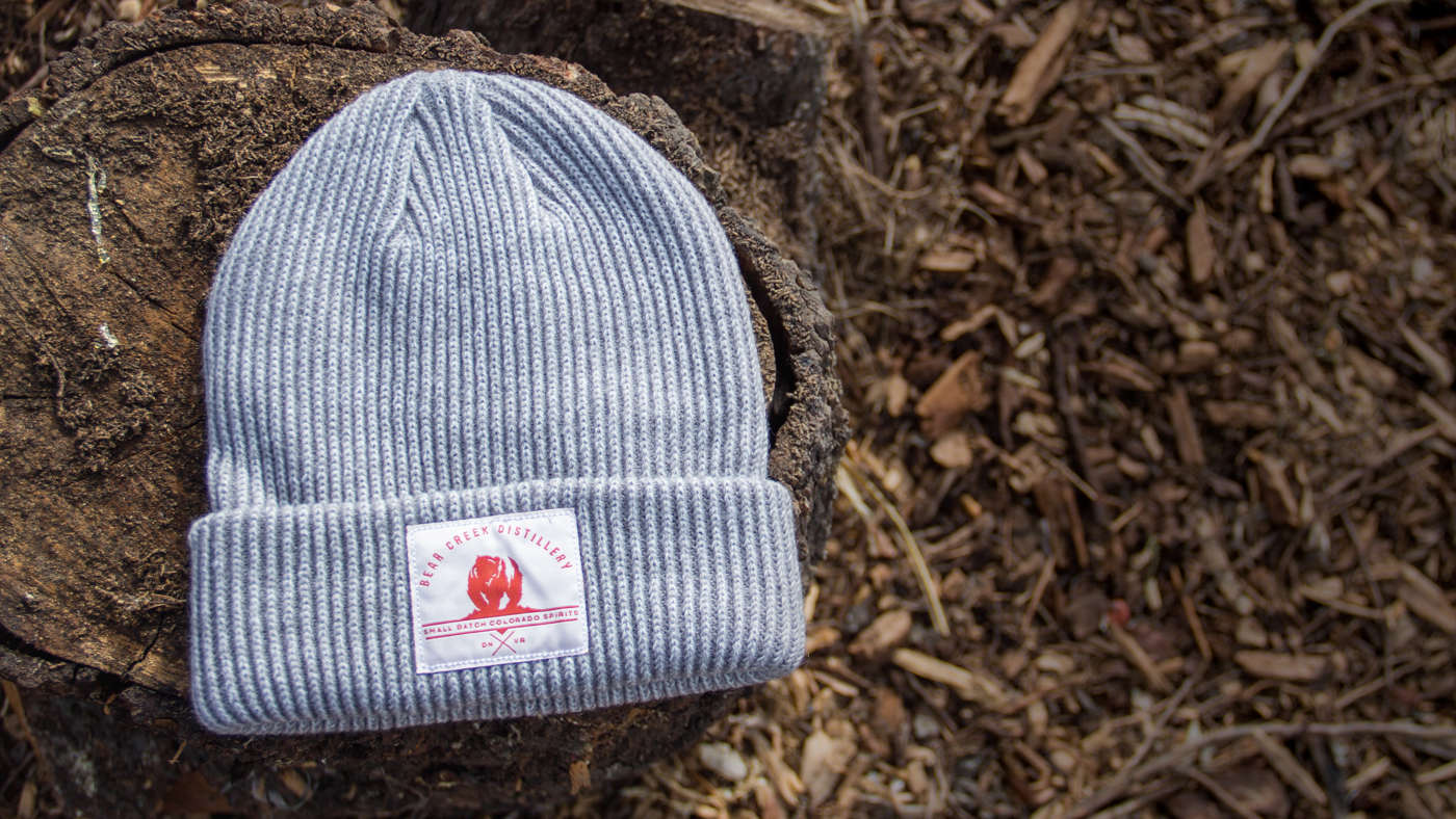 Longshoreman Knit laying on a tree stump