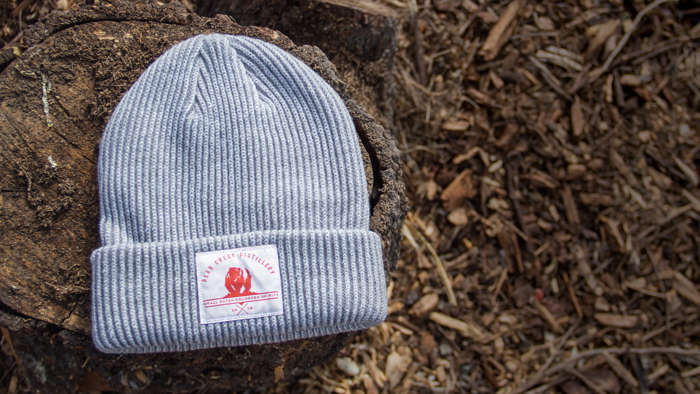 Longshoreman Knit laying on a tree stump