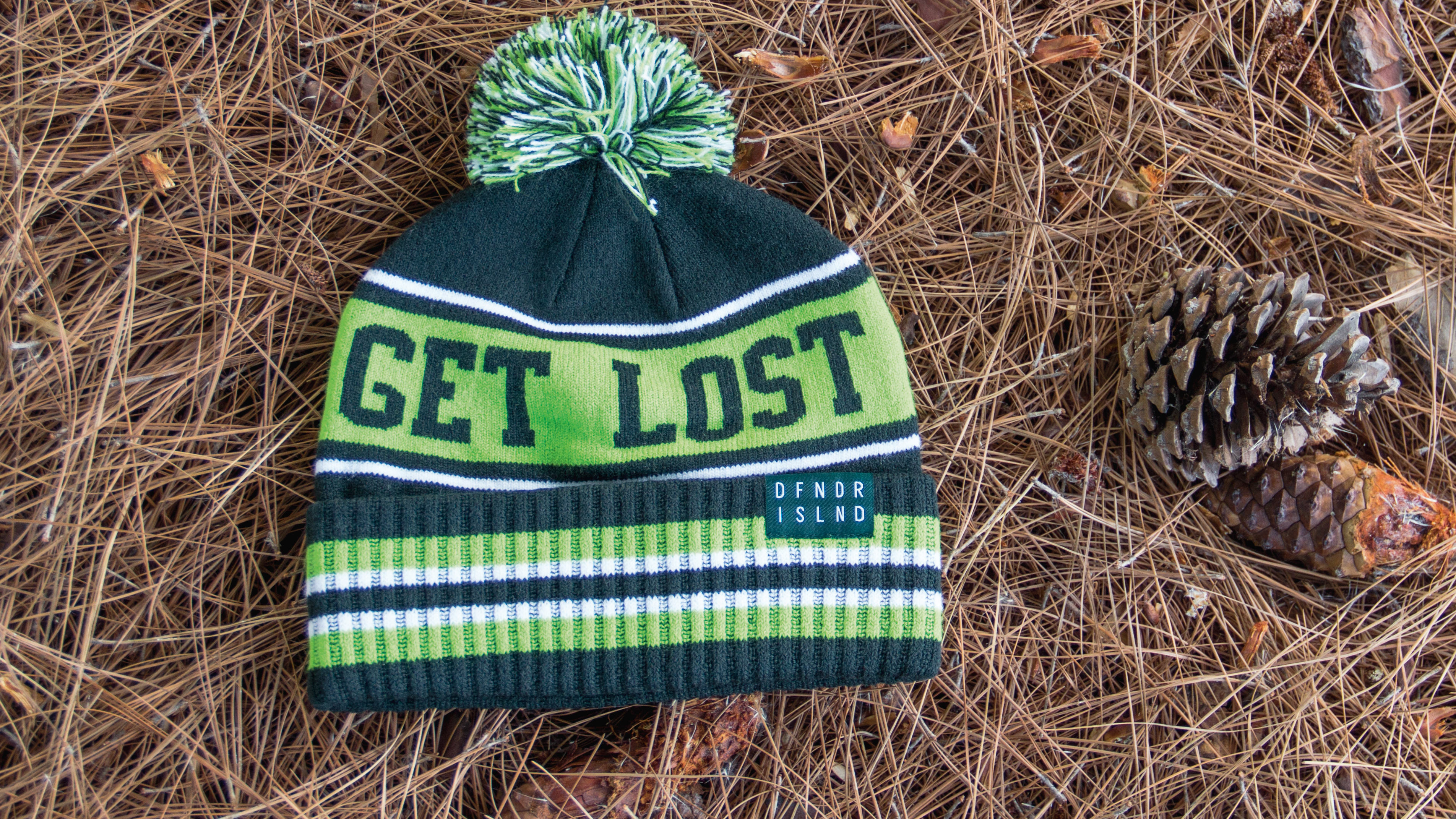 Cuffed Knit laying on pine needles