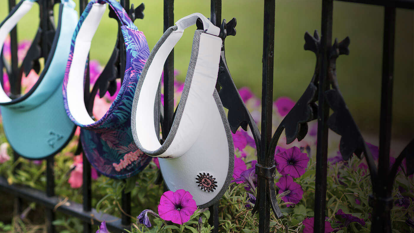 Visors laying on green grass